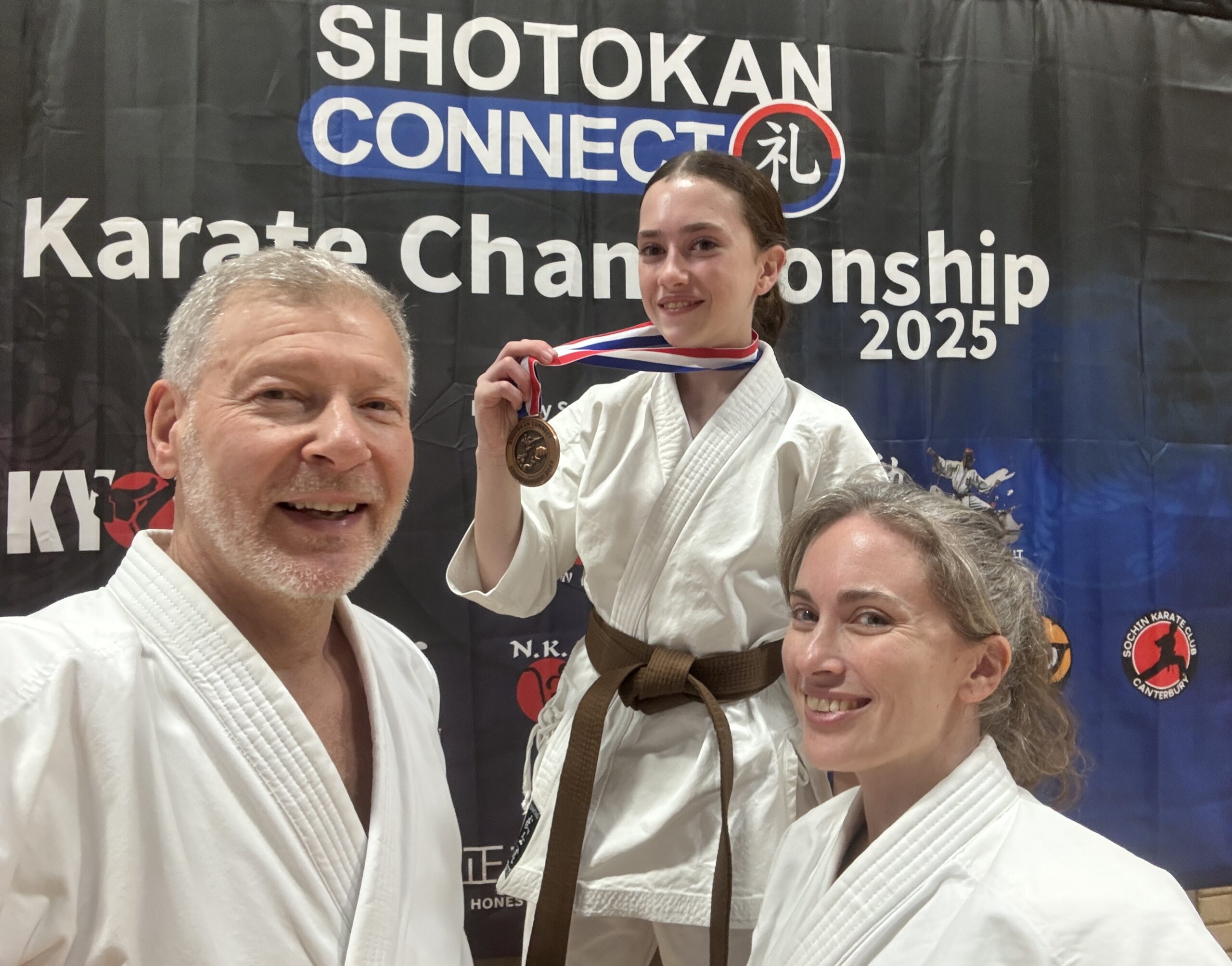 Mae Rosen shows off medal watched by Simon and Emma